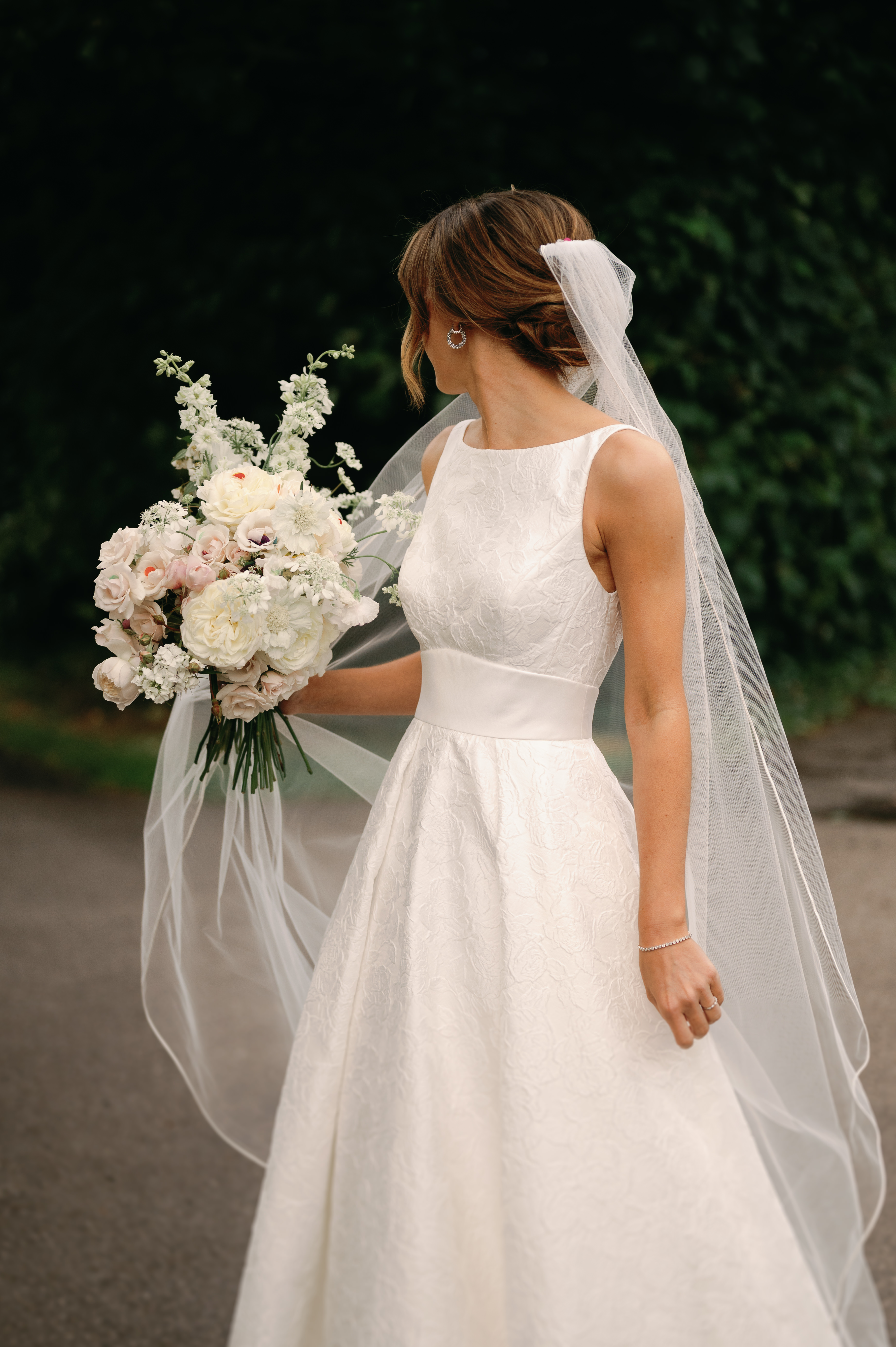 Bride looking away over her shoulder
