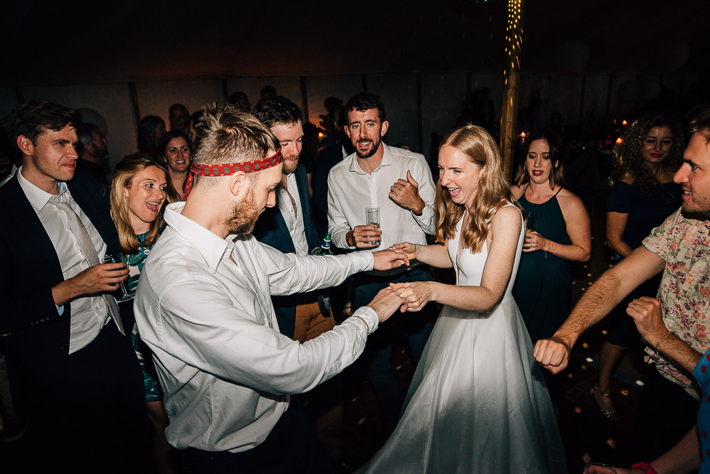 bride and groom dancing at wedding in marquee